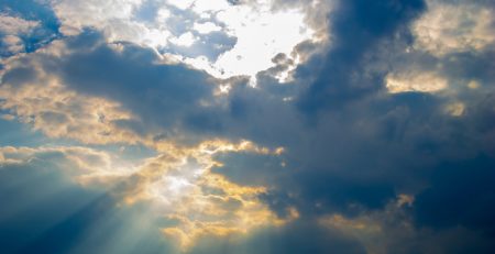 Sheaff Brock Money Management | clouds with sunlight and blue sky shimmering through | glimmers of hope in stock market news